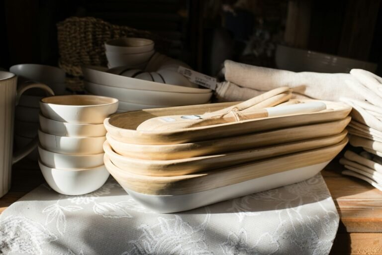 Stack of wooden serving bowls with utensils